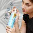 Mujer aplicando el protector solar capilar Valquer en spray para proteger el cabello del sol