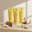 Bodegón del Pack x3 Hydra Sunscreen SPF 50+ de Valquer, crema solar facial hidratante de textura fluida.