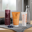 Pack Gym & Go de Valquer con sérum solar facial SPF 50+, agua de peinado y VR bálsamo reparador sobre toalla de gimnasio