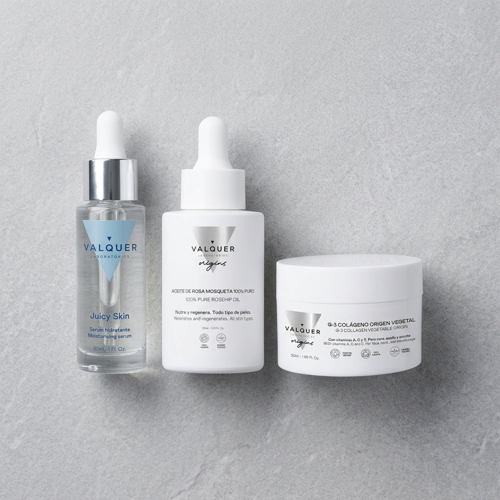 Pack Reparación Intensiva de Valquer con crema de colágeno, sérum de rosa mosqueta y sérum hidratante sobre fondo gris