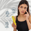 Mujer mostrando el Sérum Solar Facial Invisible SPF 50+ de Valquer, vegano, dermatológicamente testado y resistente al agua.